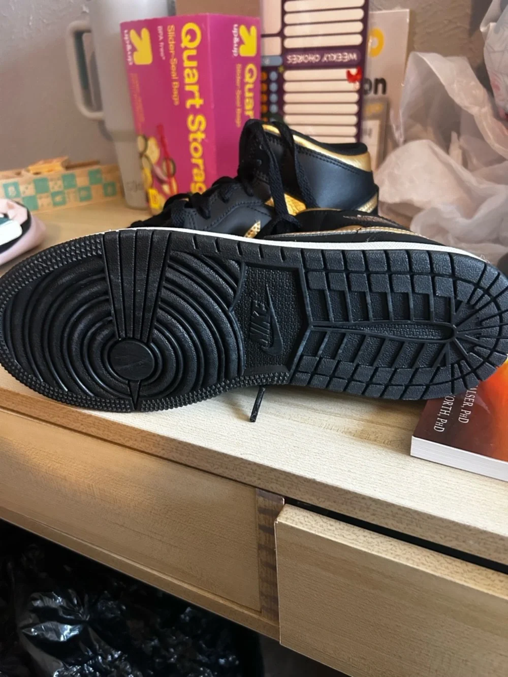 Air Jordan 1 Black and Gold Mid-Top Sneaker